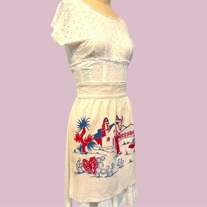 Vintage 1950s linen printed apron with dancing señorita desert scene